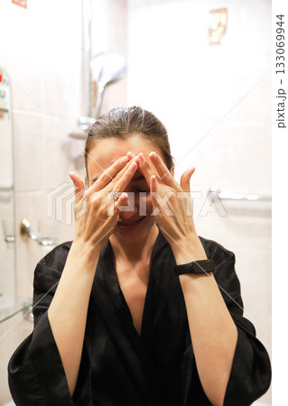 Woman Applying Face Cream, Bathroom Routine Woman Applying Face Cream, Bathroom Routine 133069944