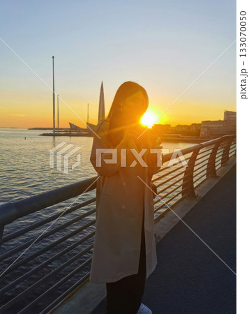 Golden Hour: City Sunset and Tranquil Waters Golden Hour: City Sunset and Tranquil Waters 133070050