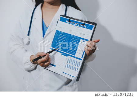 Portrait of female doctor, holding file Portrait of female doctor, holding file 133071233