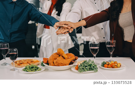Diversity, dinner and group of people toast celebration together at party. Friends, happy and celebrate with food, wine and friendship for love, support and cheers champagne at business function Diversity, dinner and group of people toast celebration together at party. Friends, happy and celebrate with food, wine and friendship for love, support and cheers champagne at business function 133073528