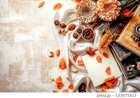 背景画像　秋　テラコッタカラー　アンティーク　古びた洋書とドライフワラーの花束　落ち葉 133075815