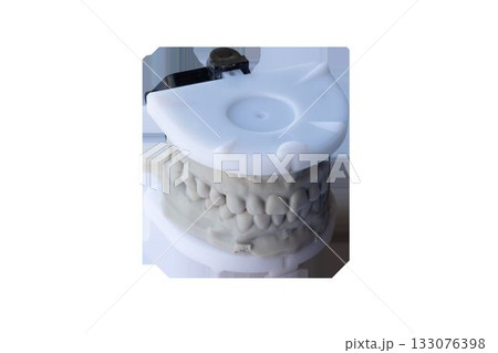 Dental model with upper and lower teeth mounted in plastic articulator for orthodontic and prosthodontic treatment planning 133076398