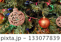 Christmas tree branches with beautiful balls and lights 133077839