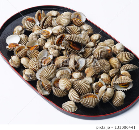 Small Clam Shells or called kerang darah in Asia On Black Plate Create Coastal Seafood Display For Food Styling 133080441
