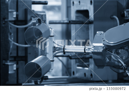 Close up scene material handling process the plastic drinking glass by robotic system. 133080972