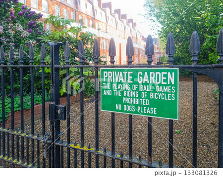 Private Garden Sign on Wrought Iron Fence. No Dogs, Urban Garden Square Private Garden Sign on Wrought Iron Fence. No Dogs, Urban Garden Square 133081326