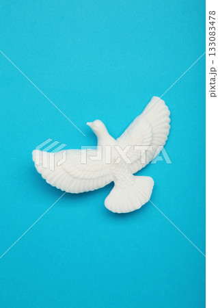 International day of peace or world peace day, symbol of peace - pigeon on blue background International day of peace or world peace day, symbol of peace - pigeon on blue background 133083478