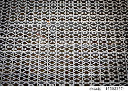 Galvanized metal grating surface for pedestrian walkway ramp or crossing providing drainage Galvanized metal grating surface for pedestrian walkway ramp or crossing providing drainage 133083874