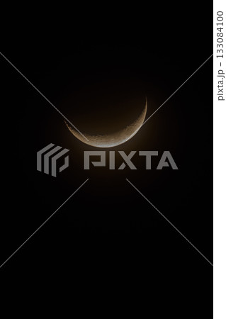 Solitary Crescent Moon Against a Pitch-Black Night Sky Solitary Crescent Moon Against a Pitch-Black Night Sky 133084100