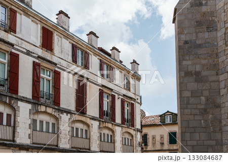 Charming white buildings with green shutters in the heart of Bayonne, France. 133084687