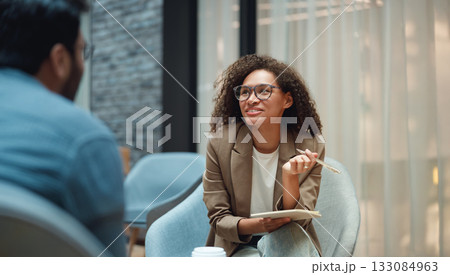 skilled mentor encourages client development by engaging attentively and demonstrating with gestures skilled mentor encourages client development by engaging attentively and demonstrating with gestures 133084963