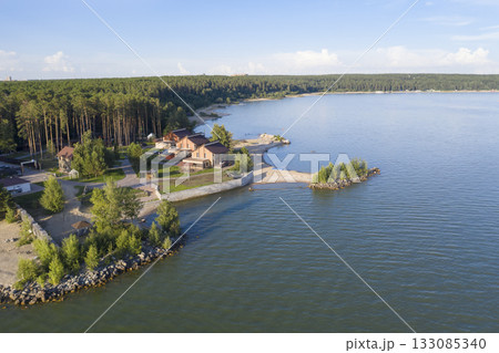 Aerial view of cottage village near the beach on the shore of the Ob Sea in Siberia in summer 133085340