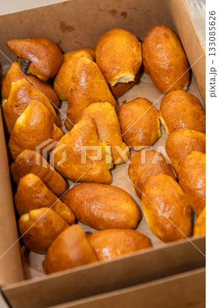Catering box with fresh baked savory pastries, ready for takeaway, delivery or buffet 133085626