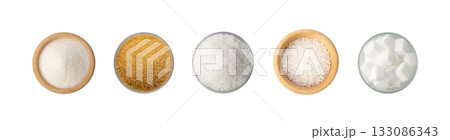 Piles of white and brown cane sugar. Assorted granulated sweetener isolated on white Piles of white and brown cane sugar. Assorted granulated sweetener isolated on white 133086343