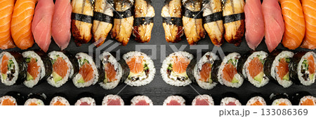 Set of Various Japanese Sushi Food on Dark Sate Plate Closeup. Nigiri and Nori Maki Sushi Rolls 133086369