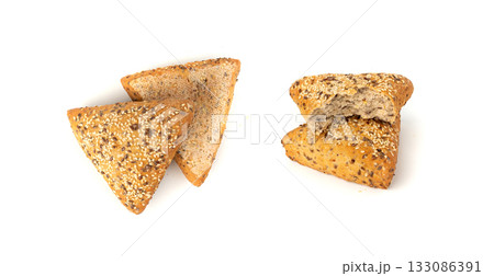 Triangular bun isolated. Wheat bread with sesame and flax seeds, healthy whole grain bakery 133086391