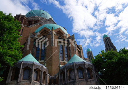 The National Basilica of the Sacred Heart, Sacre-Coeur, majestic dome, stone architecture, blue sky, Brussels, Belgium 133086544