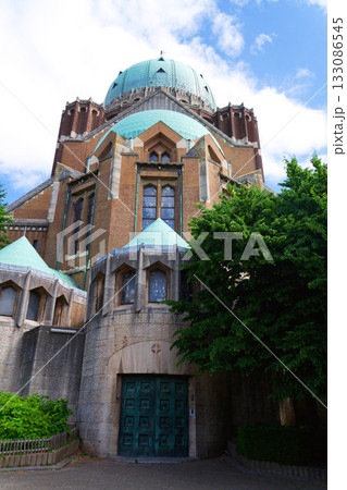 The National Basilica of the Sacred Heart, Sacre-Coeur, majestic dome, stone architecture, blue sky, Brussels, Belgium The National Basilica of the Sacred Heart, Sacre-Coeur, majestic dome, stone architecture, blue sky, Brussels, Belgium 133086545
