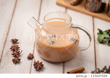 Milk tea with spices in teapot 133087089
