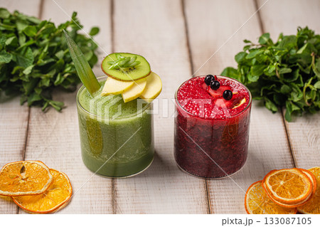 Green and berry smoothies in glasses Green and berry smoothies in glasses 133087105