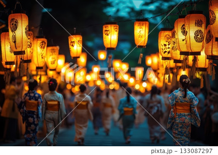Celebration of traditional culture with kimono-clad individuals walking under illuminated lanterns during a summer festival in Japan Celebration of traditional culture with kimono-clad individuals walking under illuminated lanterns during a summer festival in Japan 133087297