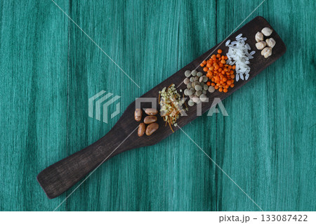 Different type of raw dry legumes composition. White beans, lentils, bulgur, chickpeas, kidney beans, corns, rice, Mix organic legume concept 133087422