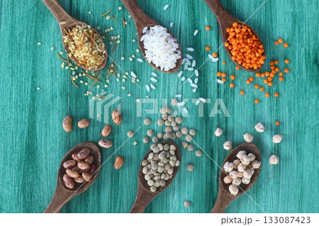 Different type of raw dry legumes composition. White beans, lentils, bulgur, chickpeas, kidney beans, corns, rice, Mix organic legume concept 133087423
