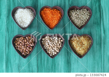 Different type of raw dry legumes composition. White Rice, lentils, red lentils, chickpeas and kidney beans. 133087424