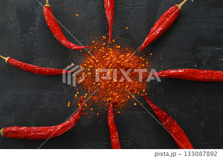 cayenne pepper on wooden spoon spices and dried chilli peppers background group of red hot chilli powder 133087892