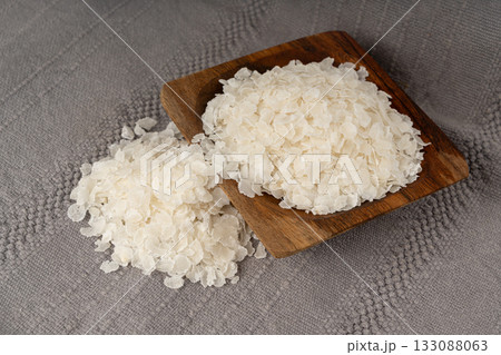 Raw flattened rice isolated. Dry rice flakes or poha, Indian breakfast food Raw flattened rice isolated. Dry rice flakes or poha, Indian breakfast food 133088063