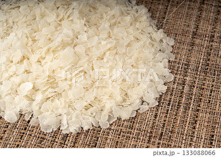 Raw flattened rice. Dry rice flakes or poha, Indian breakfast food 133088066