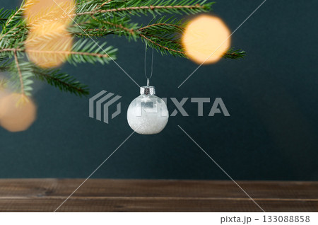 Fir tree branches, a Christmas tree ornament with a bokeh effect from the garland Fir tree branches, a Christmas tree ornament with a bokeh effect from the garland 133088858