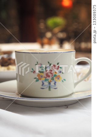 Beautiful floral tea cup on a table setting 133089375