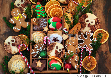 Sweet Christmas cookies in wooden box on rustic table, top view Sweet Christmas cookies in wooden box on rustic table, top view 133089812