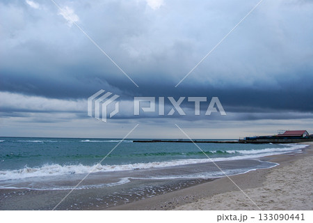 Beautiful seascape of the Black Sea. A seascape of the Black Sea with gentle waves lapping a sandy beach. 133090441
