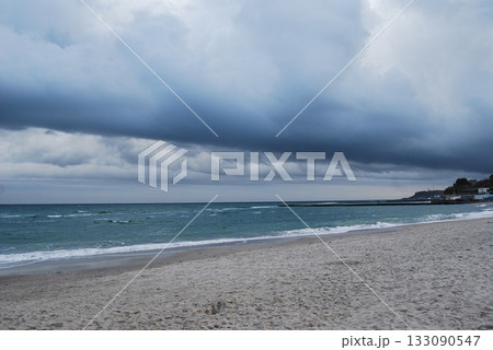 Beautiful seascape of the Black Sea. A seascape of the Black Sea with gentle waves lapping a sandy beach. Beautiful seascape of the Black Sea. A seascape of the Black Sea with gentle waves lapping a sandy beach. 133090547