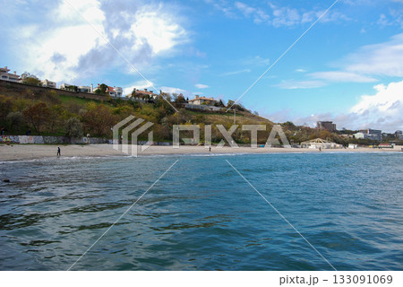 Beautiful seascape of the Black Sea. A seascape of the Black Sea with gentle waves lapping a sandy beach. Beautiful seascape of the Black Sea. A seascape of the Black Sea with gentle waves lapping a sandy beach. 133091069
