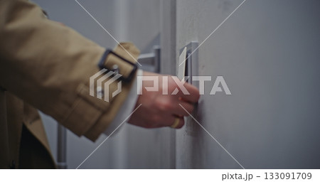 Female Hands Tapping Plastic Key Card on Electronic Door Lock Hotel Room Entrance 133091709