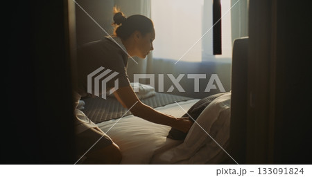 Hotel Room Attendant In Uniform Prepares Accommodation For Next Guest 133091824