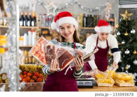 Woman seller offering jamon and meat Woman seller offering jamon and meat 133093678