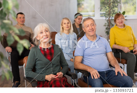 Interested elderly people listening language courses for older adults 133093721