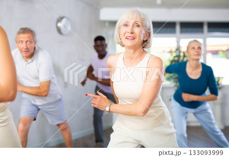 Group of multiethnic mature people dancing modern dance 133093999