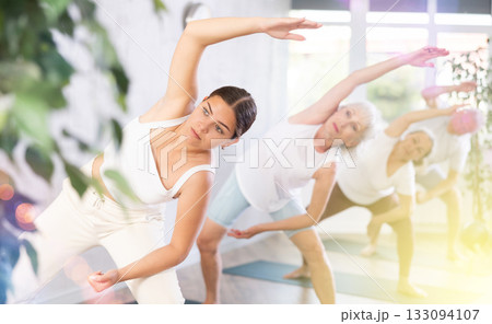 Young woman doing pilates on mat in studio Young woman doing pilates on mat in studio 133094107