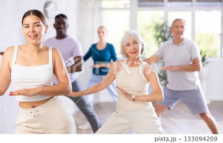 Men and women of different ages practicing Hip-hop dance in training hall Men and women of different ages practicing Hip-hop dance in training hall 133094209