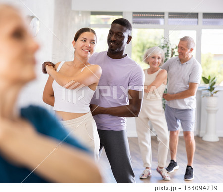 African american man dancing bachata with young female partner 133094219