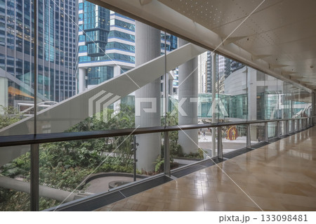 Oct 29 2025 Bright Modern Office Corridor With Glass Walls, Beige Tile Floor 133098481