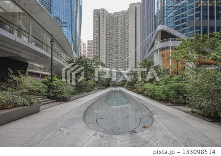 Oct 29 2025 Urban Plaza With Water Channel, Greenery And Glass Skyscraper Oct 29 2025 Urban Plaza With Water Channel, Greenery And Glass Skyscraper 133098514