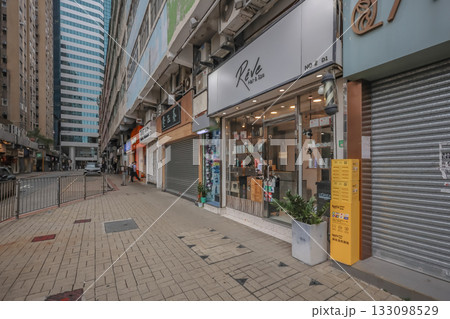 Oct 29 2025 Busy City Street With Shops, Modern Buildings and Bright Storefronts 133098529