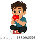 boy sit on the floor eating apple 133098556