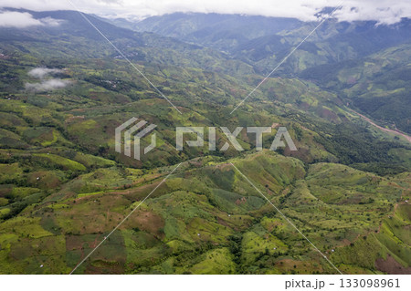 Landscape of Morning Mist with Mountain Layer at north of Thailand. mountain ridge and clouds in rural jungle bush forest Landscape of Morning Mist with Mountain Layer at north of Thailand. mountain ridge and clouds in rural jungle bush forest 133098961
